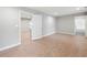 Large empty living room featuring wood-look floors with gray walls and white trim at 3121 Cox Cemetery Rd, Social Circle, GA 30025