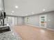 Large living room with tile flooring, granite countertops, stainless steel appliances, and access to the outside at 3121 Cox Cemetery Rd, Social Circle, GA 30025
