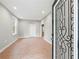 Bright living area featuring wood-look floors, recessed lighting, and a view of the entry door at 3121 Cox Cemetery Rd, Social Circle, GA 30025
