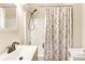 Bathroom features a decorative shower curtain and vanity with modern faucet at 707 Martin Luther King Jr Dr, Cartersville, GA 30121