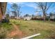 Expansive backyard offers plenty of green space and features a shed for additional storage at 965 Laurel St, Morrow, GA 30260