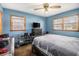 Comfortable bedroom featuring a neutral color palette, ceiling fan and bright windows at 965 Laurel St, Morrow, GA 30260