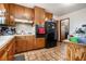 Functional kitchen featuring wooden cabinets and essential appliances, ready for your culinary creations at 965 Laurel St, Morrow, GA 30260