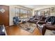 Bright living room with hardwood floors, large windows, and comfortable seating for relaxation and entertaining at 965 Laurel St, Morrow, GA 30260