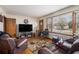 Comfortable living room with hardwood floors and plenty of natural light, creating a warm and inviting atmosphere at 965 Laurel St, Morrow, GA 30260