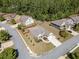 Aerial view of a well-maintained single-story home with manicured lawn, trees, and a long driveway in a suburban neighborhood at 2190 Leatherstone Dr, Powder Springs, GA 30127