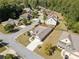 Aerial view showcases the property's landscaping, roof, and location in a suburban neighborhood with tree-lined streets at 2190 Leatherstone Dr, Powder Springs, GA 30127