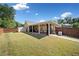 Wide view of backyard with storage shed and covered patio at 2190 Leatherstone Dr, Powder Springs, GA 30127