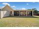 Expansive backyard featuring a covered patio and a storage shed for added convenience at 2190 Leatherstone Dr, Powder Springs, GA 30127