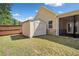 Backyard includes a storage shed with a window near the home's screened-in porch at 2190 Leatherstone Dr, Powder Springs, GA 30127
