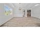 Elegant dining room with decorative ceilings, large window, and open access to other living areas at 2190 Leatherstone Dr, Powder Springs, GA 30127