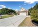 Charming home exterior with a long driveway and well-maintained landscaping at 2190 Leatherstone Dr, Powder Springs, GA 30127