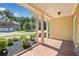Cozy front porch with classic columns, providing a welcoming entrance and framed by green landscaping and neighboring homes at 2190 Leatherstone Dr, Powder Springs, GA 30127