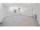 Spacious two car garage with sealed concrete floors and a side service door at 2190 Leatherstone Dr, Powder Springs, GA 30127