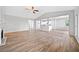 Open-concept living room featuring vaulted ceiling and open access to the adjacent kitchen at 2190 Leatherstone Dr, Powder Springs, GA 30127