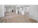 Open floor plan with kitchen island and living room with a fireplace at 2190 Leatherstone Dr, Powder Springs, GA 30127