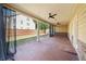 View of the large covered patio with ceiling fans, ideal for relaxing and enjoying the outdoors at 2190 Leatherstone Dr, Powder Springs, GA 30127