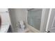 Bathroom featuring a toilet and tub with frosted glass shower doors at 4252 Parkview Ct, Stone Mountain, GA 30083