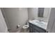 Clean bathroom featuring a gray vanity with a white marble countertop at 4252 Parkview Ct, Stone Mountain, GA 30083