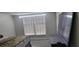 Bedroom with gray walls and carpet and a large screen TV at 4252 Parkview Ct, Stone Mountain, GA 30083
