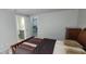 View of bedroom leading to bathroom with coordinated gray-toned walls at 4252 Parkview Ct, Stone Mountain, GA 30083