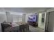 Bedroom with a large TV and open doorway to another room at 4252 Parkview Ct, Stone Mountain, GA 30083
