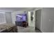 View of bedroom with TV, closets, and opened doorway to living area at 4252 Parkview Ct, Stone Mountain, GA 30083