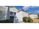 Exterior view of a multi-Gathering building with light grey siding and white trim and blue skies above at 4252 Parkview Ct, Stone Mountain, GA 30083