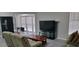 Inviting living room with modern flooring, a TV, and lots of natural light at 4252 Parkview Ct, Stone Mountain, GA 30083