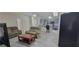 Open-concept living room with modern flooring and a view into the adjacent kitchen at 4252 Parkview Ct, Stone Mountain, GA 30083