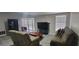 Inviting living room with modern flooring, a TV, and lots of natural light at 4252 Parkview Ct, Stone Mountain, GA 30083