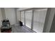 Bright sun room with large windows and modern light gray plank flooring at 4252 Parkview Ct, Stone Mountain, GA 30083
