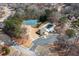 Aerial view of a community pool, tennis courts, and parking at 9122 Golfview Cir, Covington, GA 30014