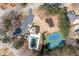 Aerial view of community amenities including a pool, tennis courts, playground, parking, and clubhouse at 9122 Golfview Cir, Covington, GA 30014
