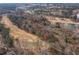 Picturesque aerial view of the golf course, trees, and community at 9122 Golfview Cir, Covington, GA 30014