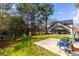 Lush backyard featuring a green lawn, trees, and house at 9122 Golfview Cir, Covington, GA 30014