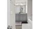 Elegant bathroom features double vanity sinks, granite countertops, and a soaking tub at 9122 Golfview Cir, Covington, GA 30014