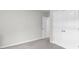 Bright bedroom with neutral carpet and fresh, white paint at 9122 Golfview Cir, Covington, GA 30014