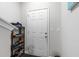 Functional entryway featuring a white door, providing a practical space for shoes and belongings at 9122 Golfview Cir, Covington, GA 30014