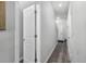 Neutral hallway with clean lines, and gray floors, creating a seamless flow between rooms within the home at 9122 Golfview Cir, Covington, GA 30014