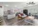 Open-concept living area with a kitchen, breakfast bar, and seating, ideal for entertaining and everyday living at 9122 Golfview Cir, Covington, GA 30014