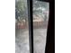 Backyard view through sliding glass doors showing a pond and a wood fence at 1110 Country Ct, Lawrenceville, GA 30044