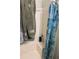 Bathroom showing shower with tiled wall and glass shower doors at 1110 Country Ct, Lawrenceville, GA 30044