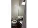 Powder room with stylish black countertop and fixtures at 1110 Country Ct, Lawrenceville, GA 30044