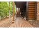 Backyard path with wooden stairs leading to a tranquil outdoor space with towering trees at 6029 Shadburn Ferry Rd, Buford, GA 30518