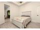 Bedroom with white wood floors and a paisley bedspread at 6029 Shadburn Ferry Rd, Buford, GA 30518