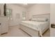 Comfortable bedroom featuring neutral colors, ample natural light, and a serene atmosphere for a restful night's sleep at 6029 Shadburn Ferry Rd, Buford, GA 30518