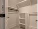Well-organized walk-in closet with ample shelving and hanging space, providing optimal storage solutions at 6029 Shadburn Ferry Rd, Buford, GA 30518