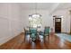 Cozy dining area showcasing hardwood floors, accent rug, and designer lighting at 6029 Shadburn Ferry Rd, Buford, GA 30518