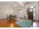 Elegant dining room with hardwood floors, a decorative rug and abundant natural light at 6029 Shadburn Ferry Rd, Buford, GA 30518